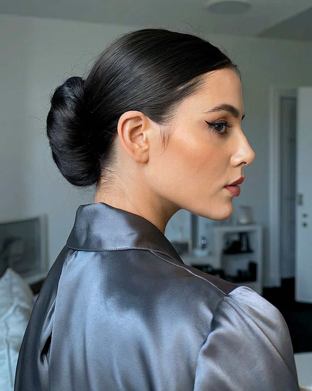Sleek French twist updo with smooth finish for formal or office looks