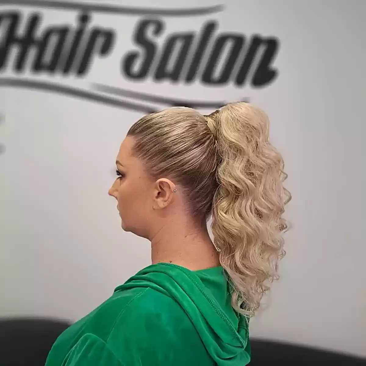 Sleek Ponytail with Loose Curls for Long Blonde Hair
