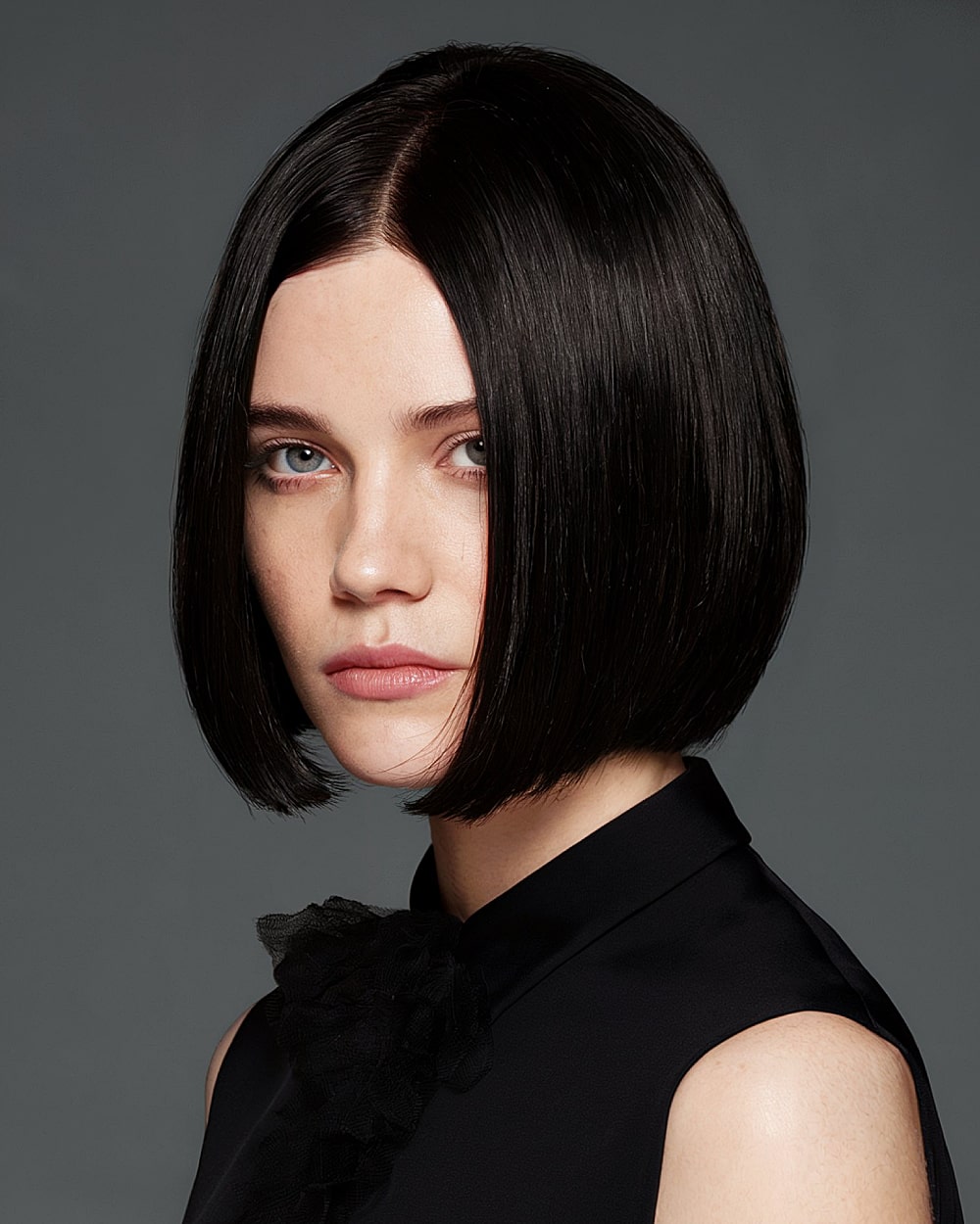 Glossy pinch bob with center part and ultra-sleek finish for medium to thick straight hair