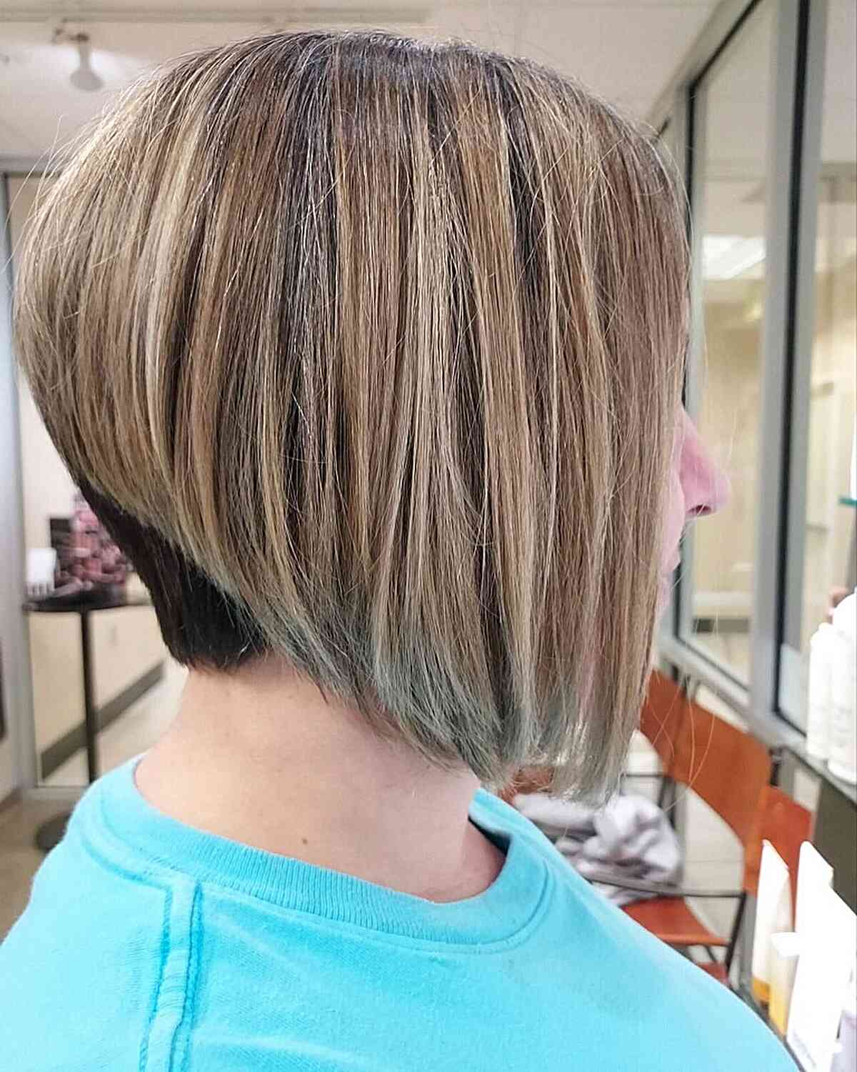 Stacked Angled Short Wedged Hair with Blonde Highlights