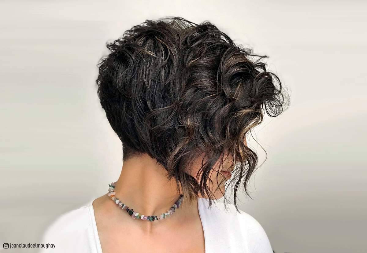 Image of Stacked shag with side part curly hair