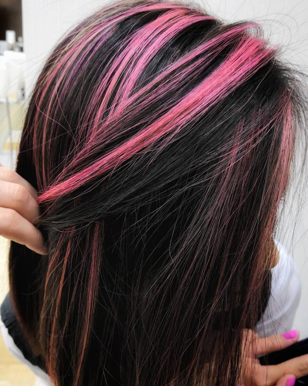 Straight Black Hair amongst Pink Highlights.