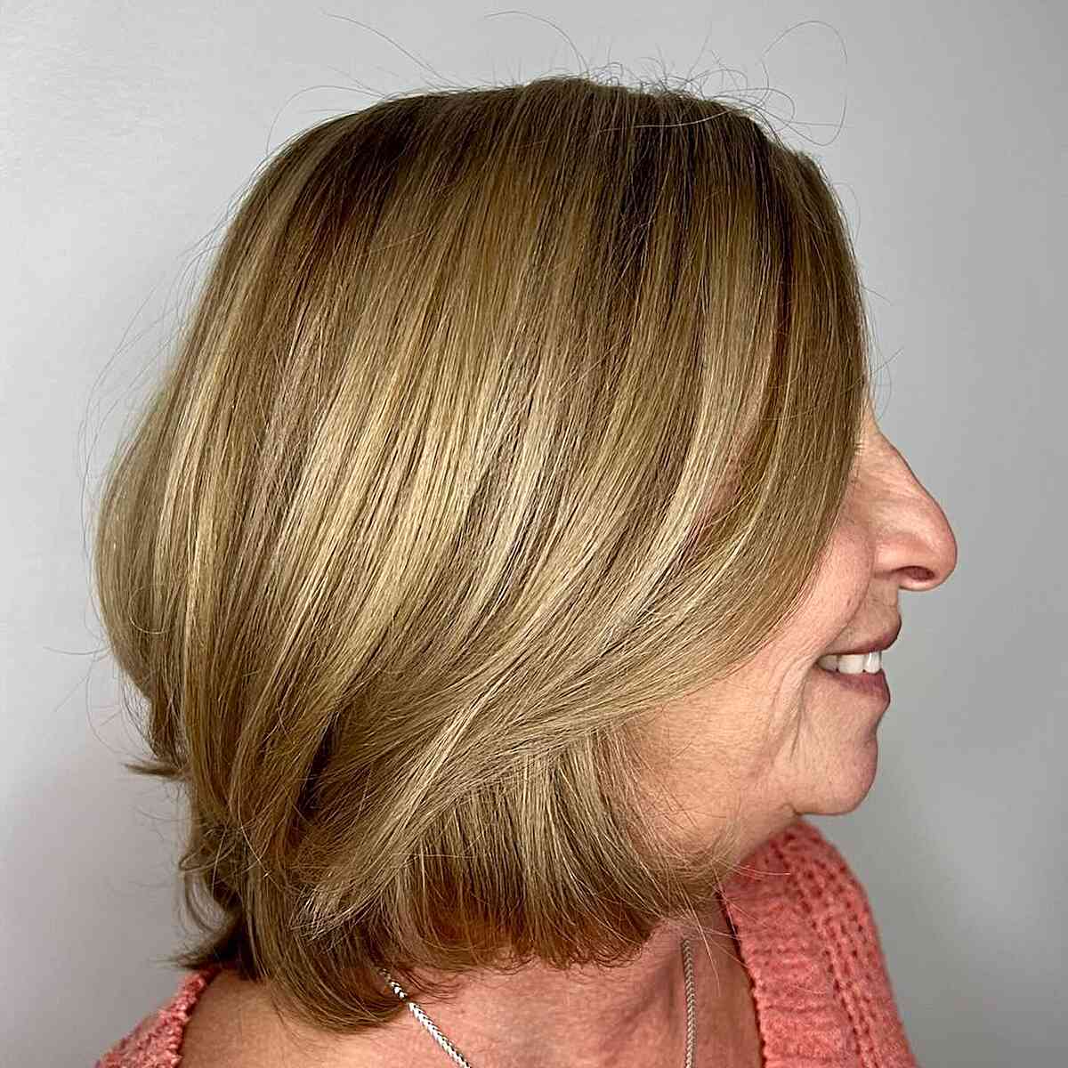 Sun-Kissed Long Bob with Blended Layers for Thick Haired 60-year-olds