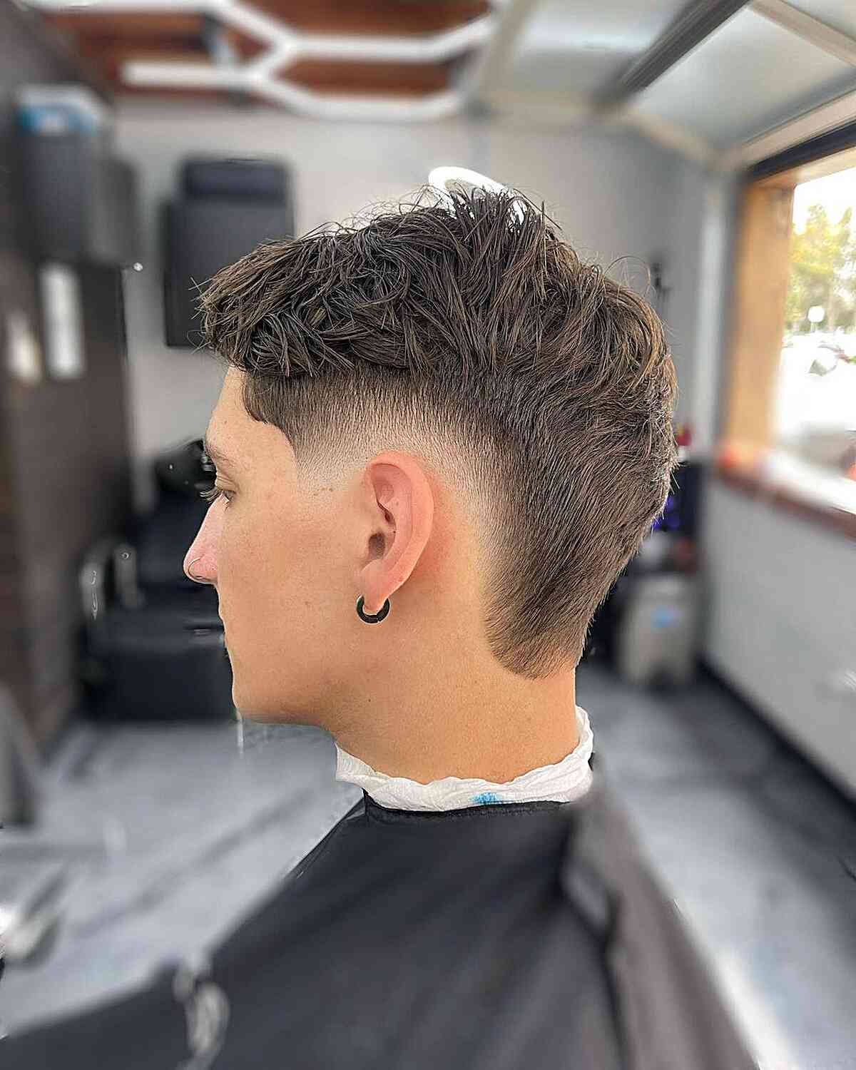 Tapered Low Burst Fade with Messy Top for Guys