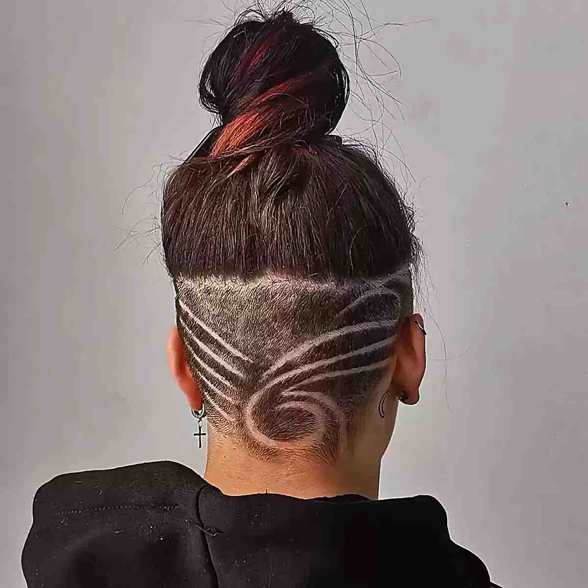 Tattooed undercut on shoulder length hair