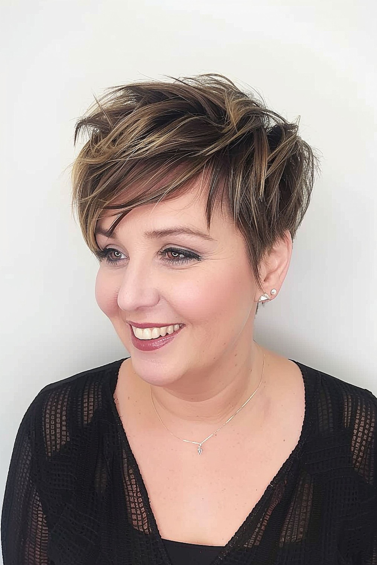 textured pixie with side-swept bangs for round face
