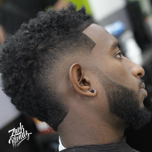 A imitation hawk fade is a type of fade that complements a imitation hawk hairstyle yesteryear adding contra xv Lit Faux Hawk Fade Haircuts for Guys