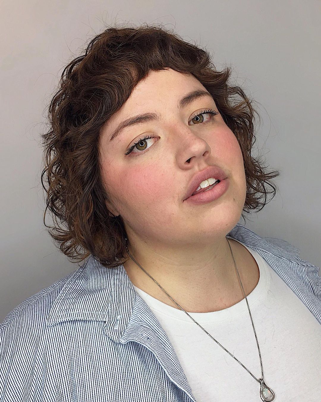 The fun Shaggy Bob Haircut on a girl with a rounded face shape