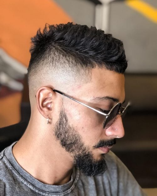 A imitation hawk fade is a type of fade that complements a imitation hawk hairstyle yesteryear adding contra xv Lit Faux Hawk Fade Haircuts for Guys