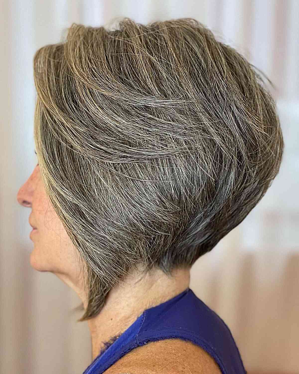 Thick Short Hair with Stacked Layers for Women Aged 60