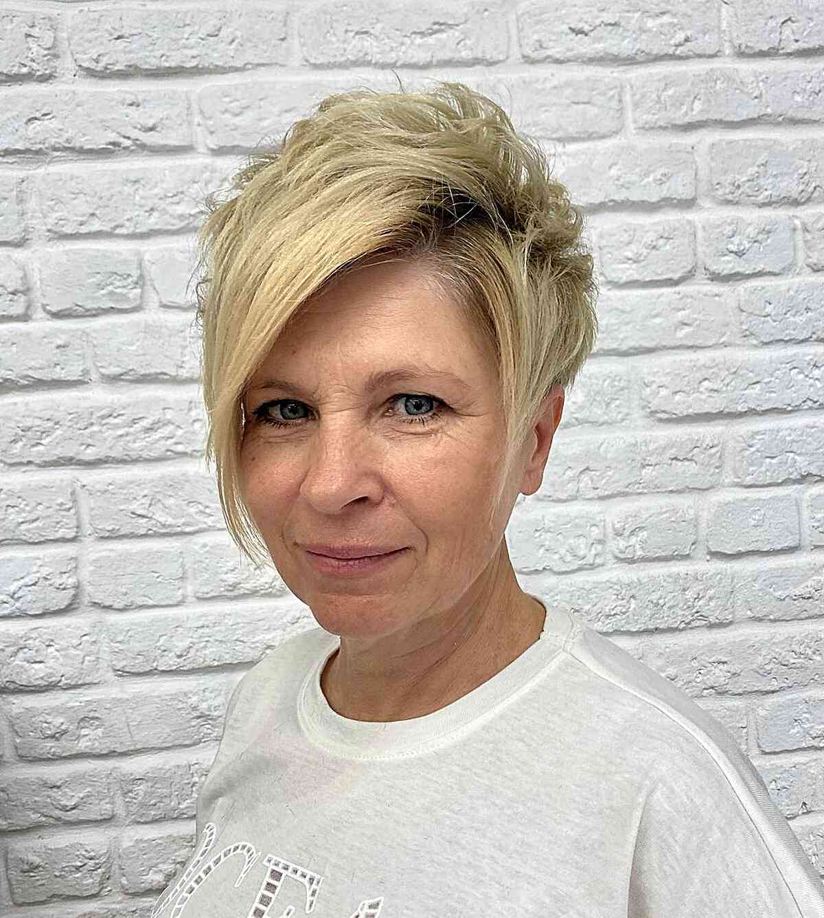 Tousled Short Pixie with Side Bangs for Seniors Aged 60 with Thicker Locks