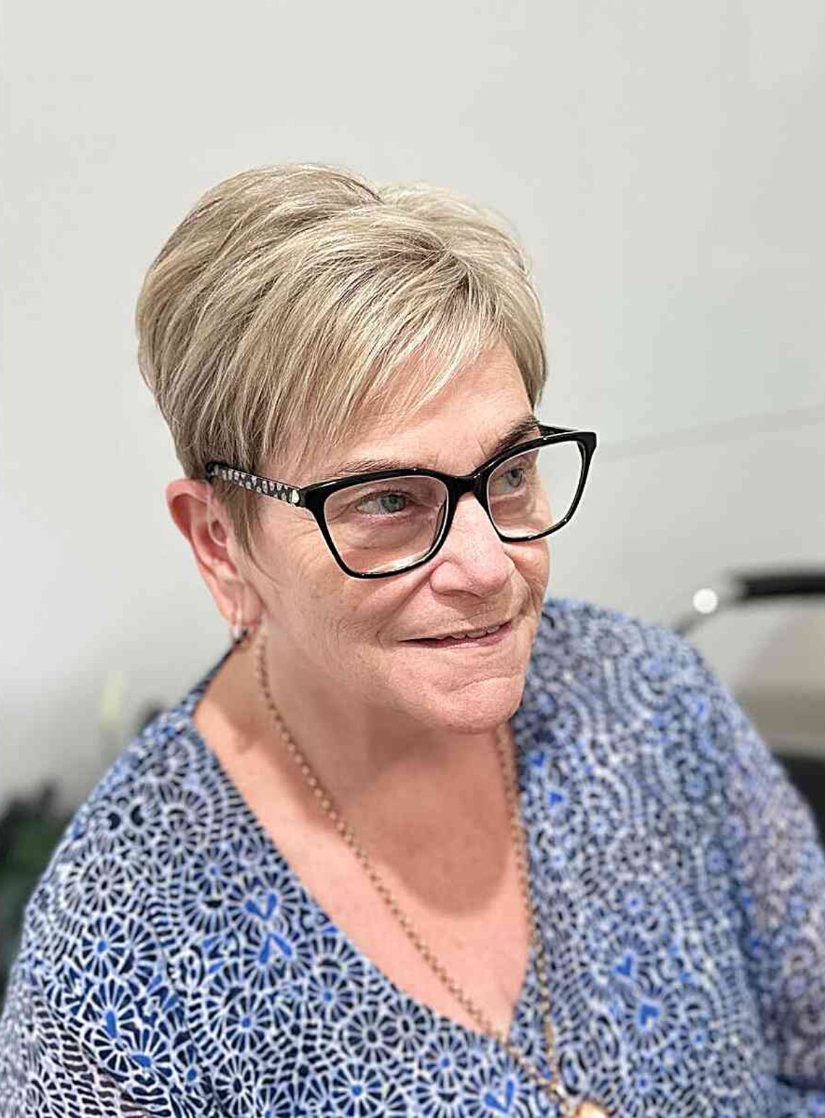 Very Short Pixie Hair with Side-Swept Bangs for Women Aged 50 with Glasses
