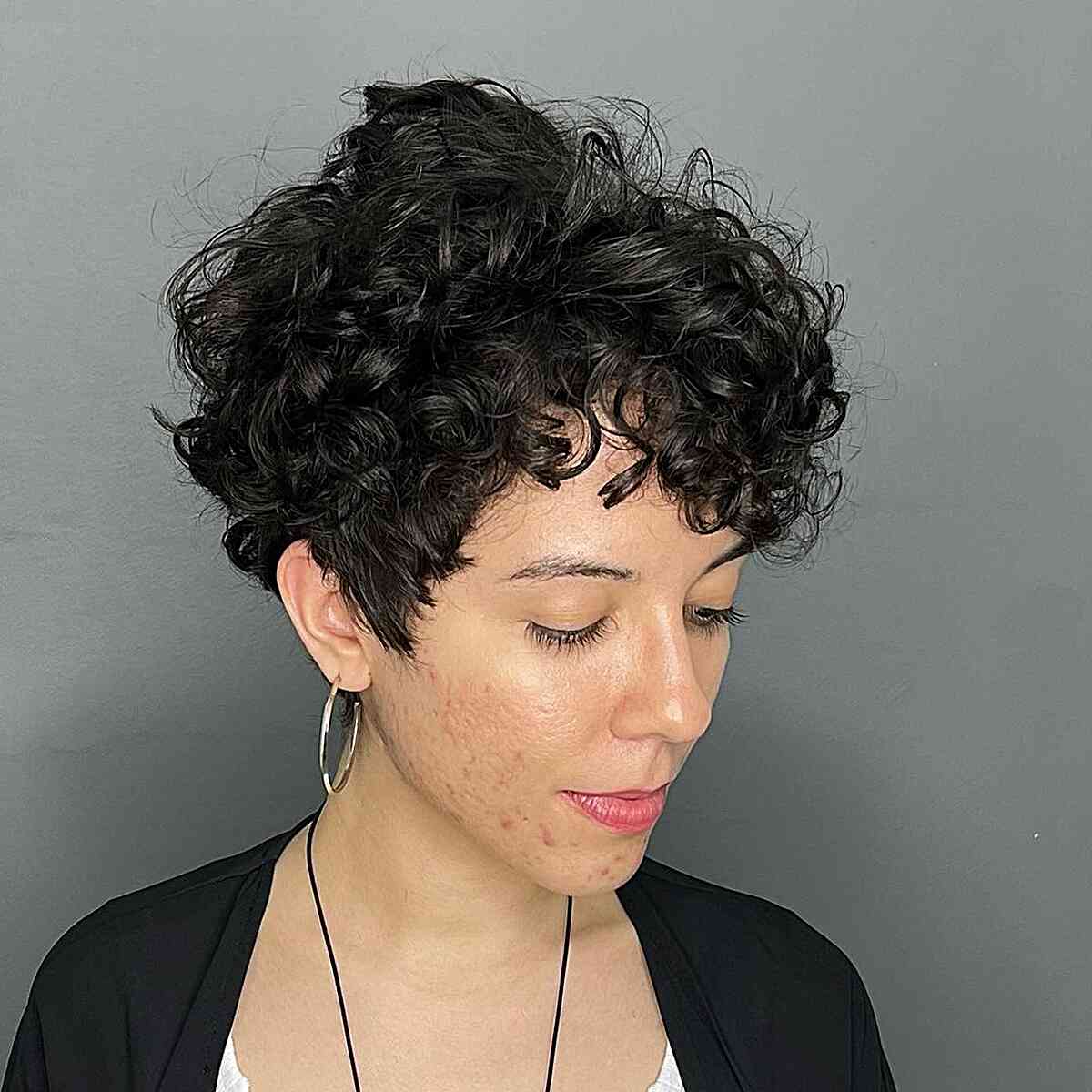 Voluminous Curly Pixie Hairstyle for Thick Hair