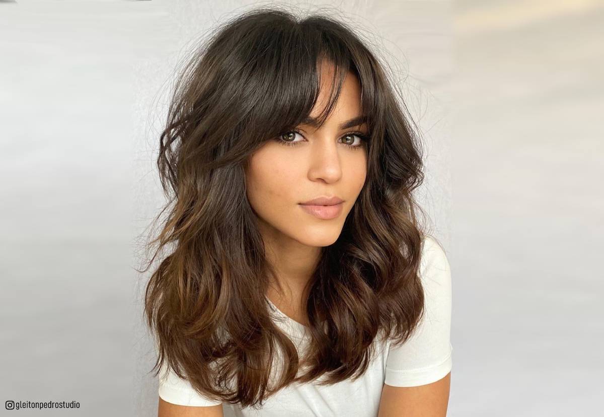 Image of Wavy long hair with side-swept bangs