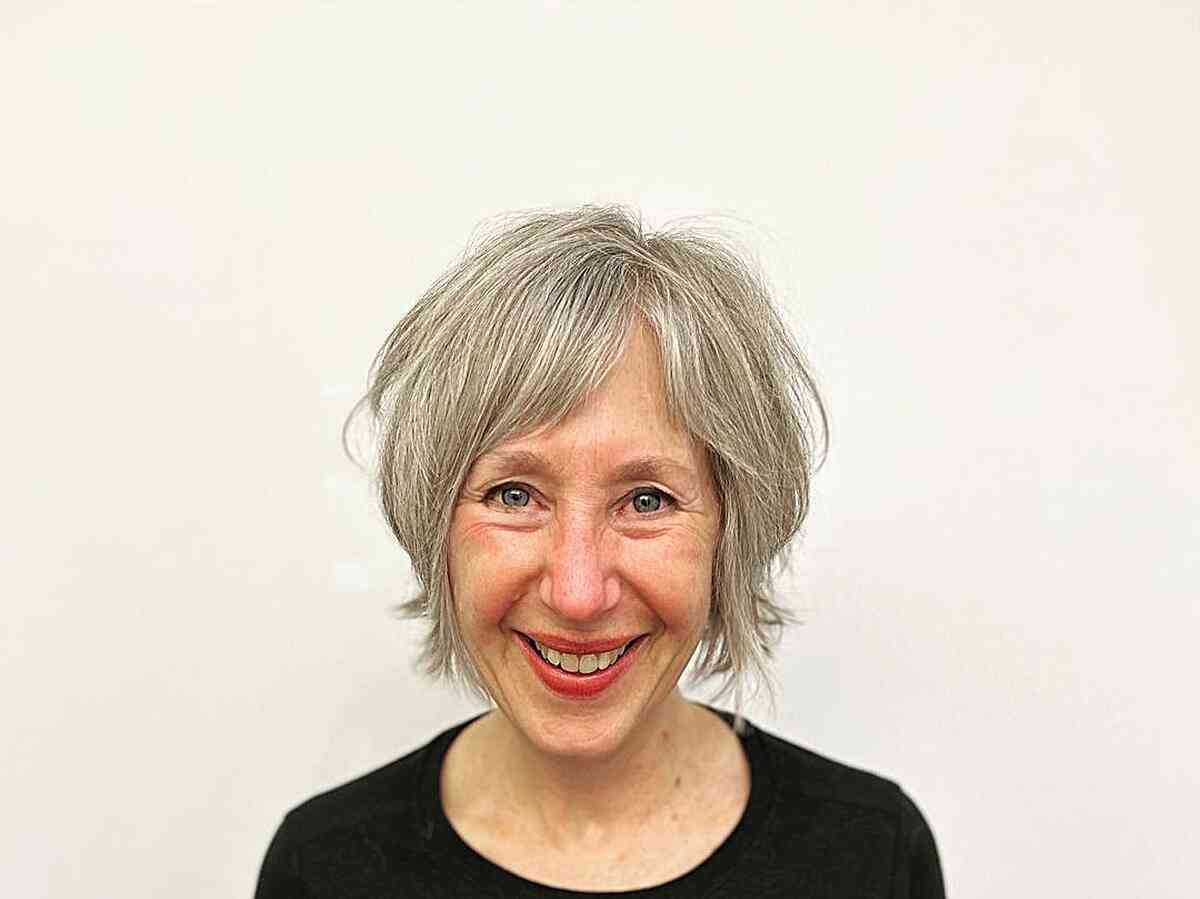 Wispy Natural Silver Hairstyle for Older Women with Long Faces